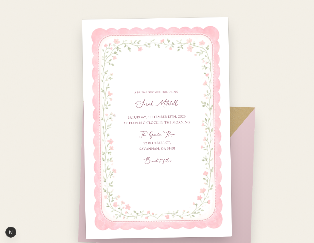 A guest's view of a bridal shower invitation resting on its envelope
